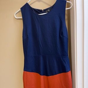 Dress is navy, orange and tan on bottom